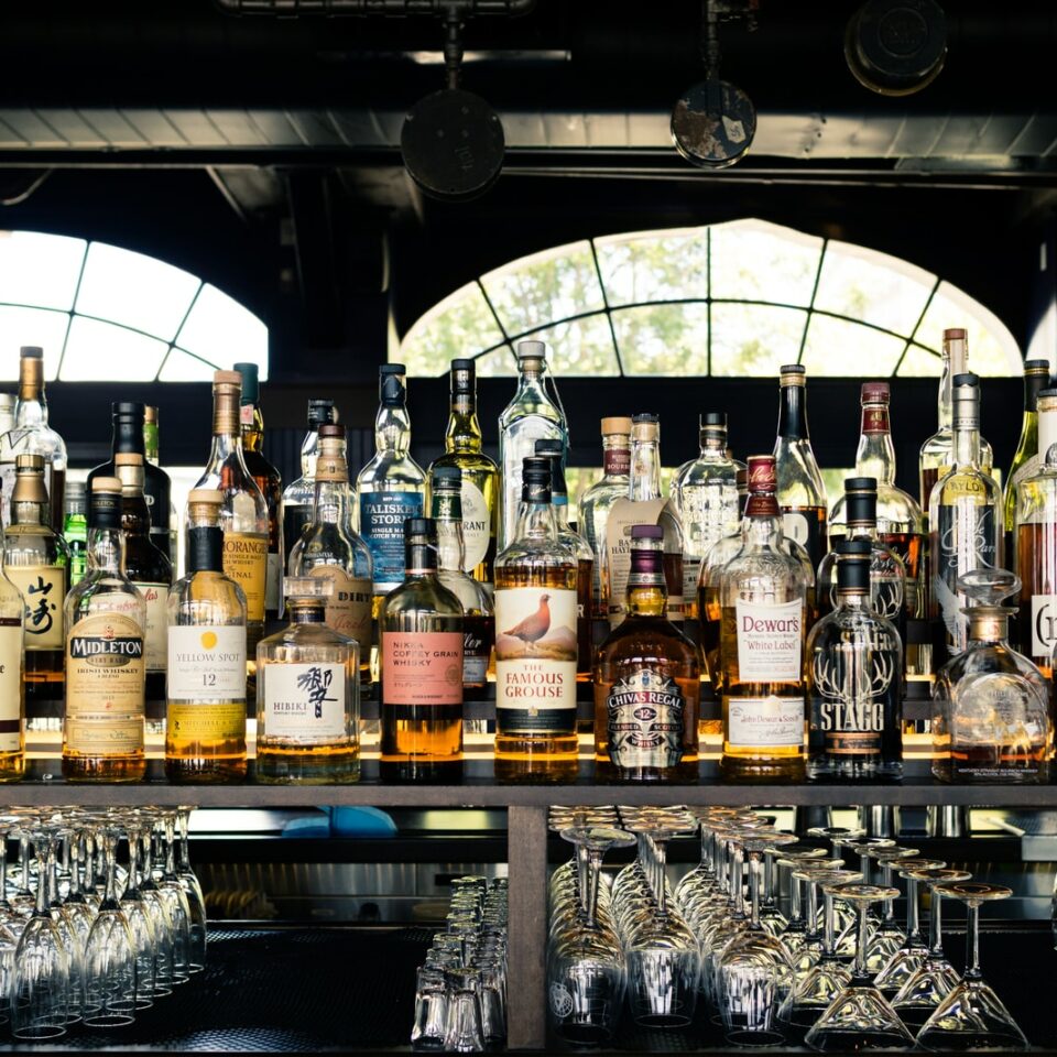 assorted liquor bottles on table